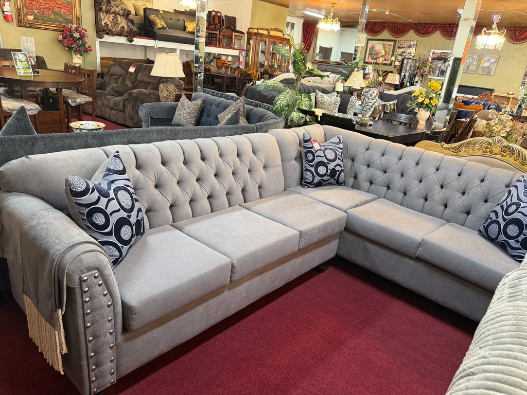 Grey Handcrafted Sectional With Blue Spotted Pillows