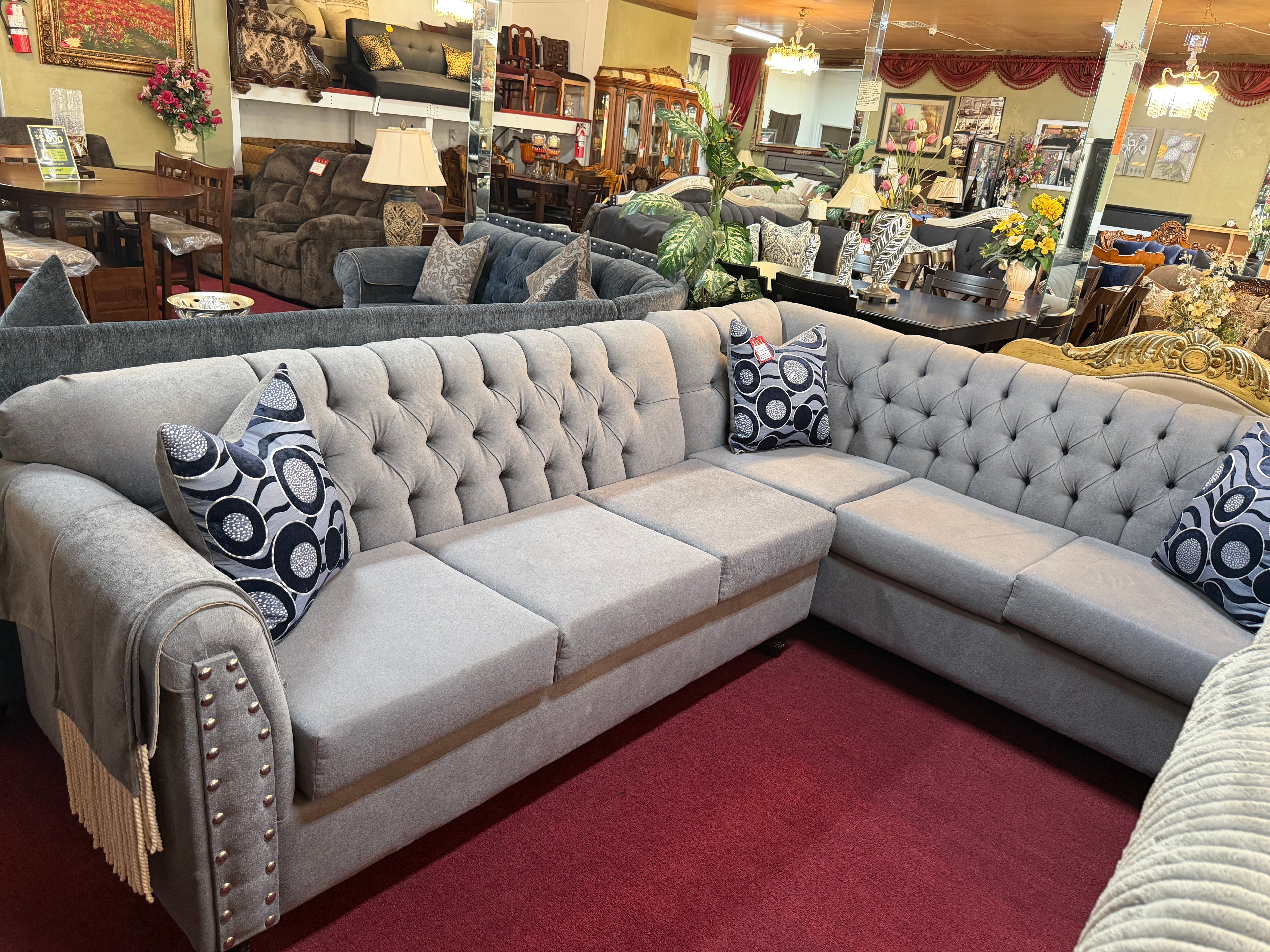 Grey Handcrafted Sectional With Blue Spotted Pillows