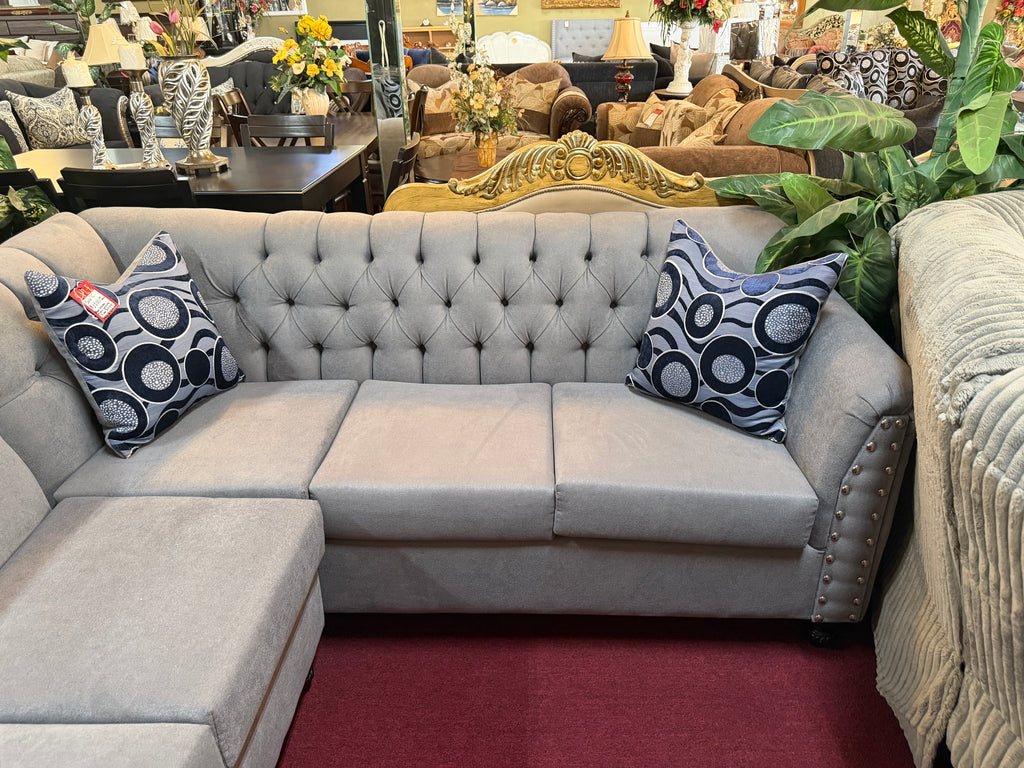 Grey Handcrafted Sectional With Blue Spotted Pillows